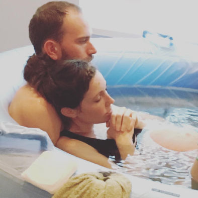 Couple in the pool for home birth