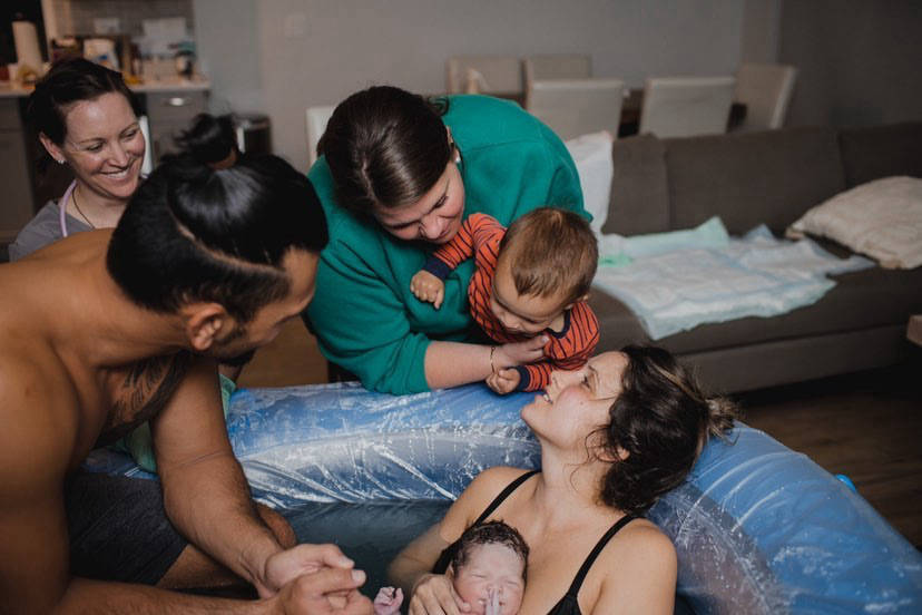 Family at water birth